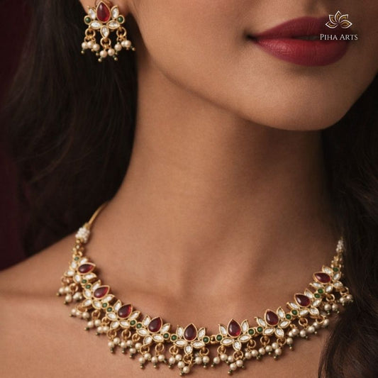 Gold Finish Kundan Necklace Set with Red & Green Stones and Pearl Earrings